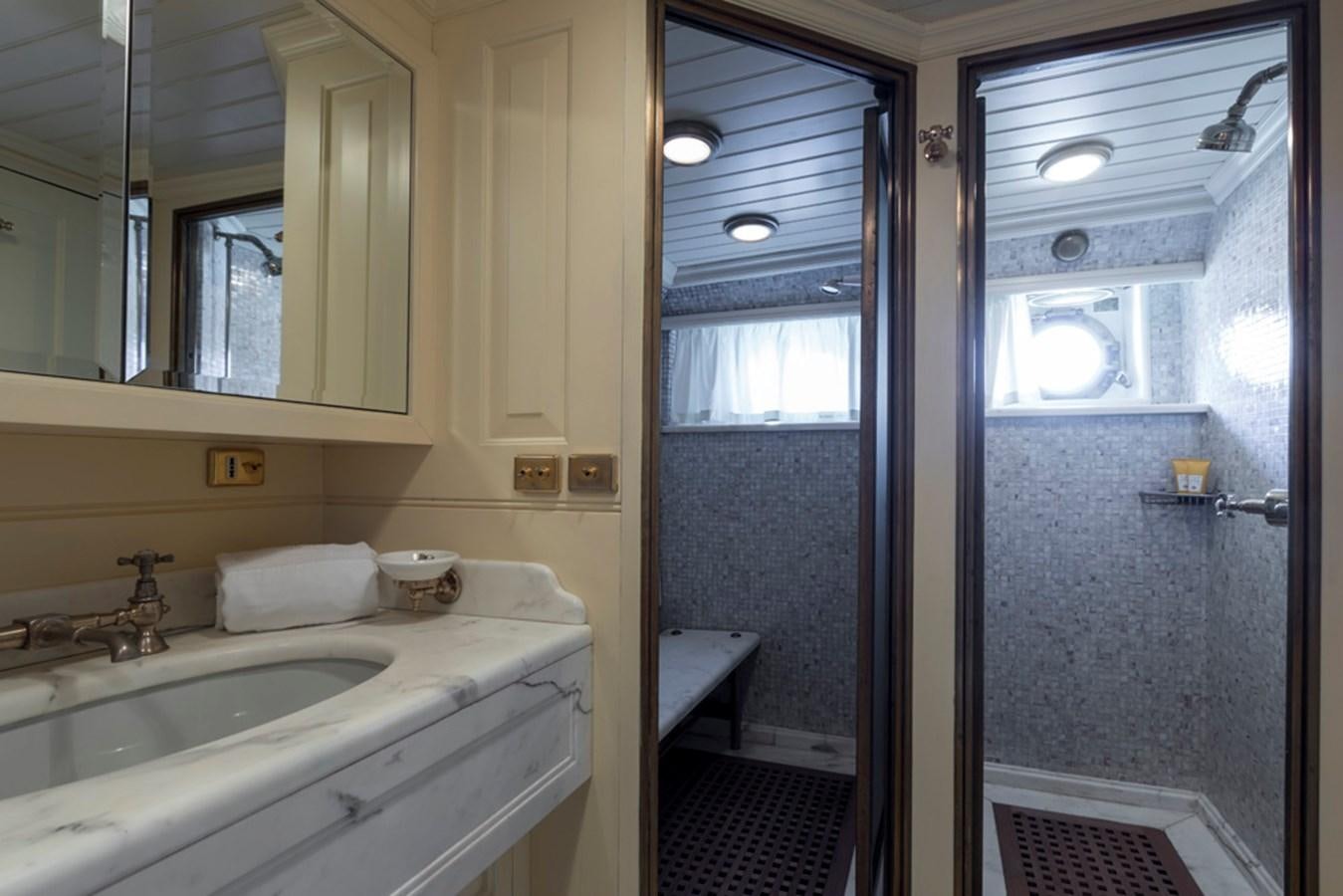 a bathroom with a sink and a shower aboard LADY MAY OF GLANDORE Yacht for Sale