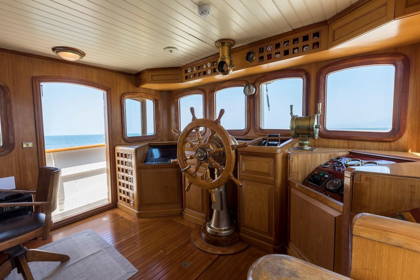 a room with a fan and a dresser and a fan aboard LADY MAY OF GLANDORE Yacht for Sale