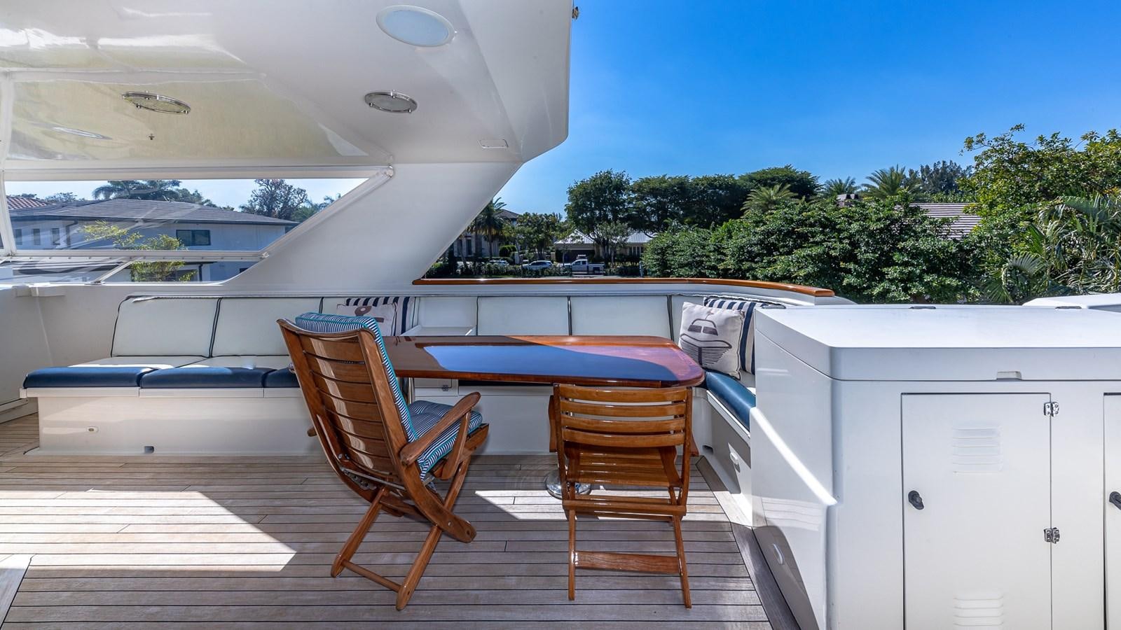 a deck with chairs and a pool aboard SEAQUEL Yacht for Sale