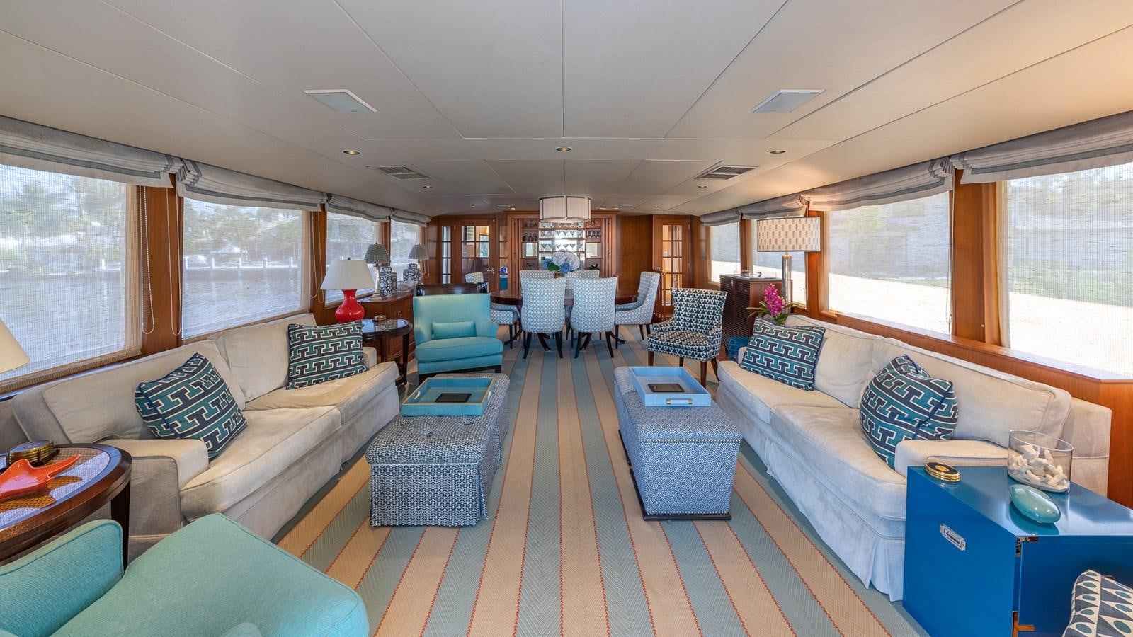 a living room with a couch and a table aboard SEAQUEL Yacht for Sale