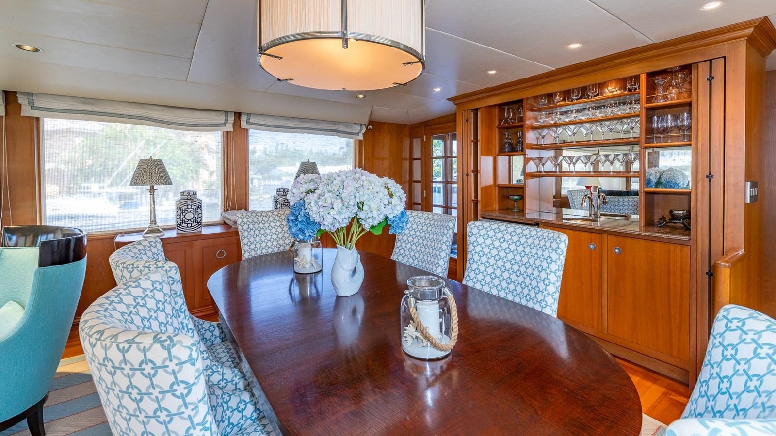 a large kitchen with a dining table aboard SEAQUEL Yacht for Sale