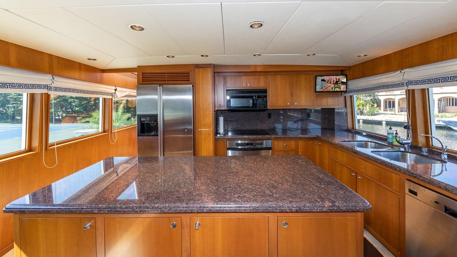 a kitchen with granite counter tops aboard SEAQUEL Yacht for Sale