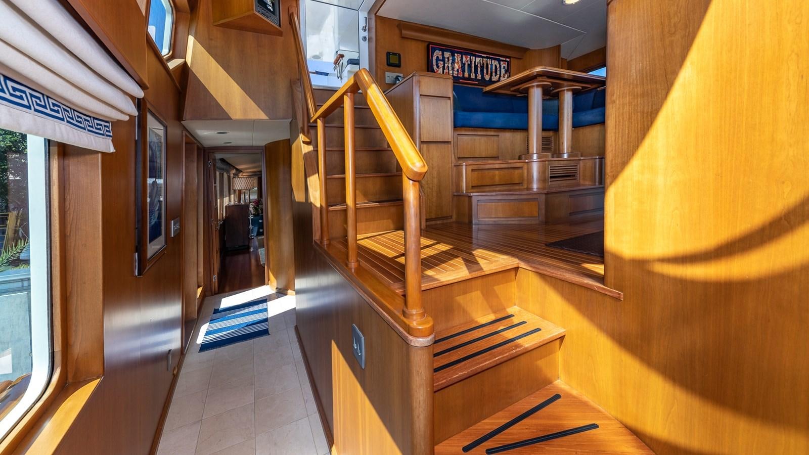 a wooden staircase in a building aboard SEAQUEL Yacht for Sale