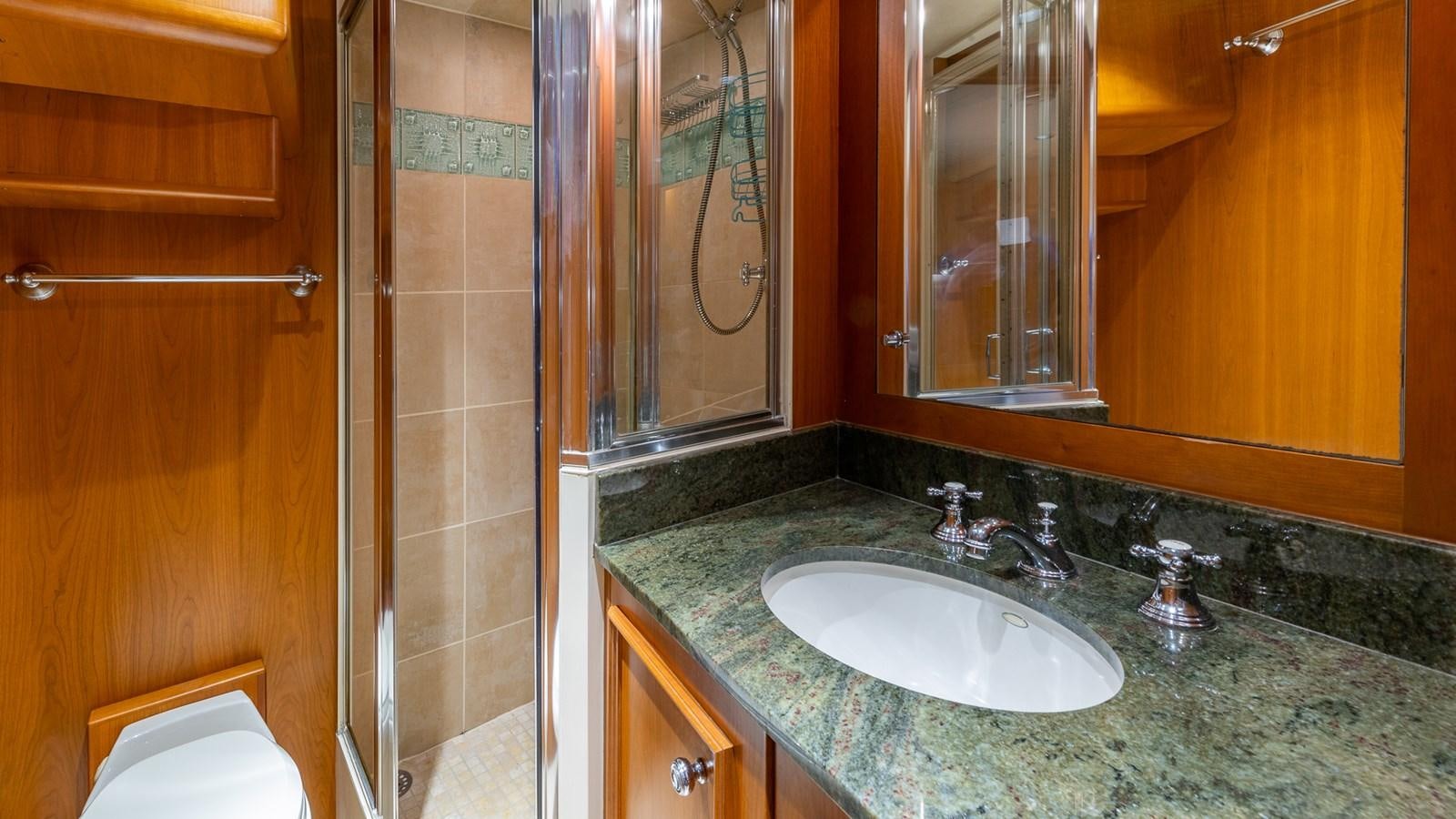 a bathroom with a marble counter top aboard SEAQUEL Yacht for Sale