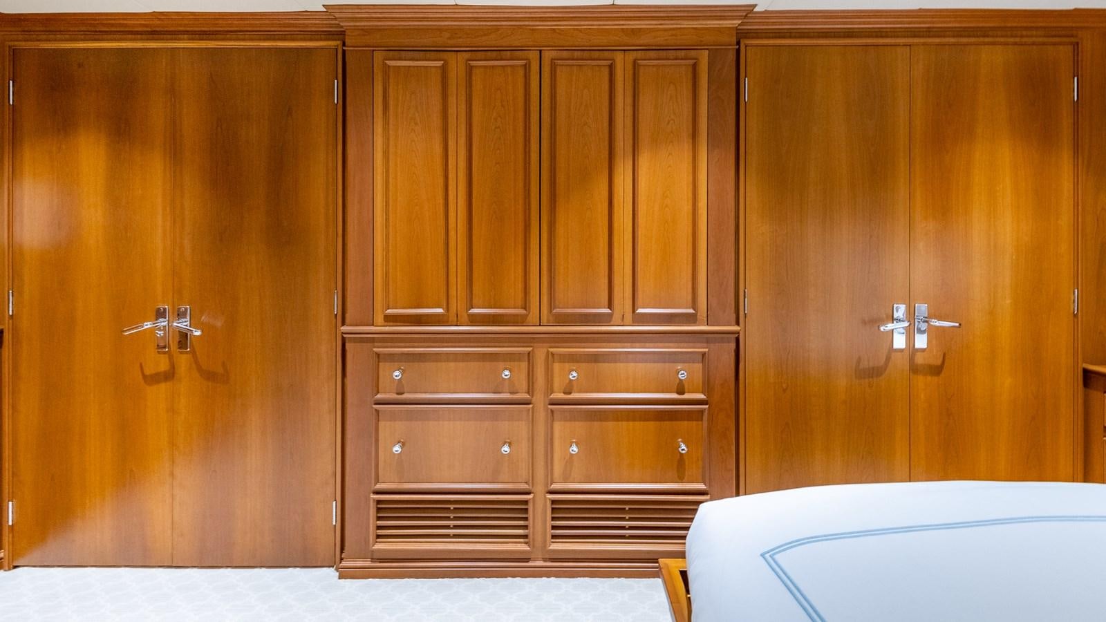 a room with wooden cabinets aboard SEAQUEL Yacht for Sale