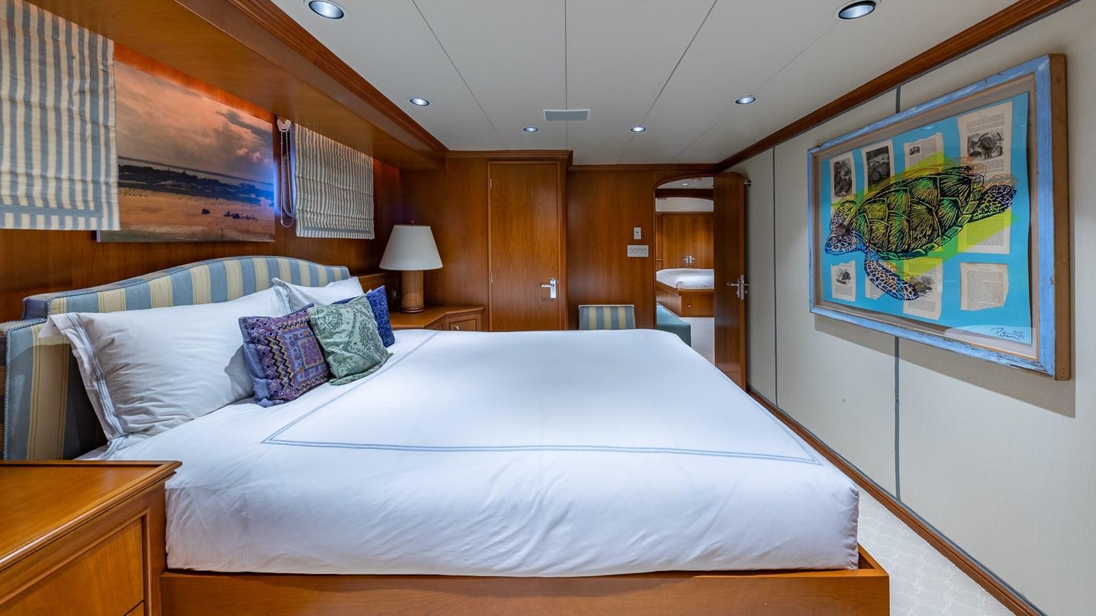 a bedroom with a large bed aboard SEAQUEL Yacht for Sale