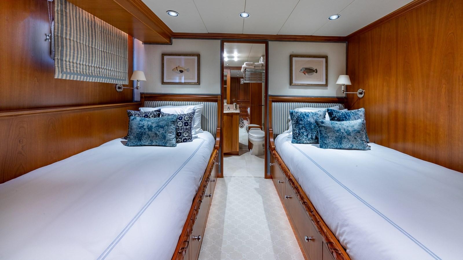a room with a couple of beds aboard SEAQUEL Yacht for Sale