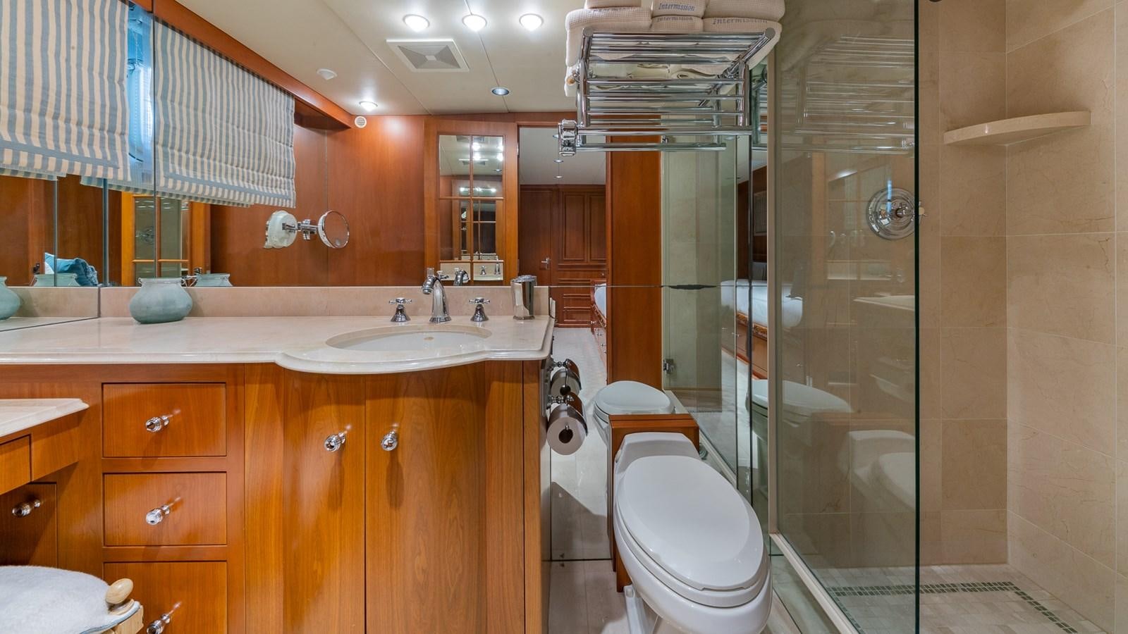 a bathroom with a glass shower aboard SEAQUEL Yacht for Sale