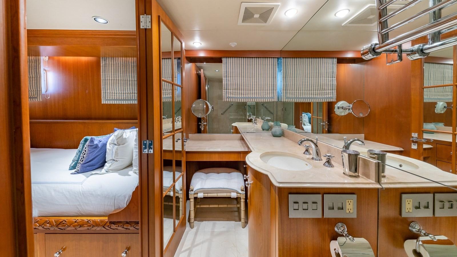 a bathroom with a bed and sink aboard SEAQUEL Yacht for Sale