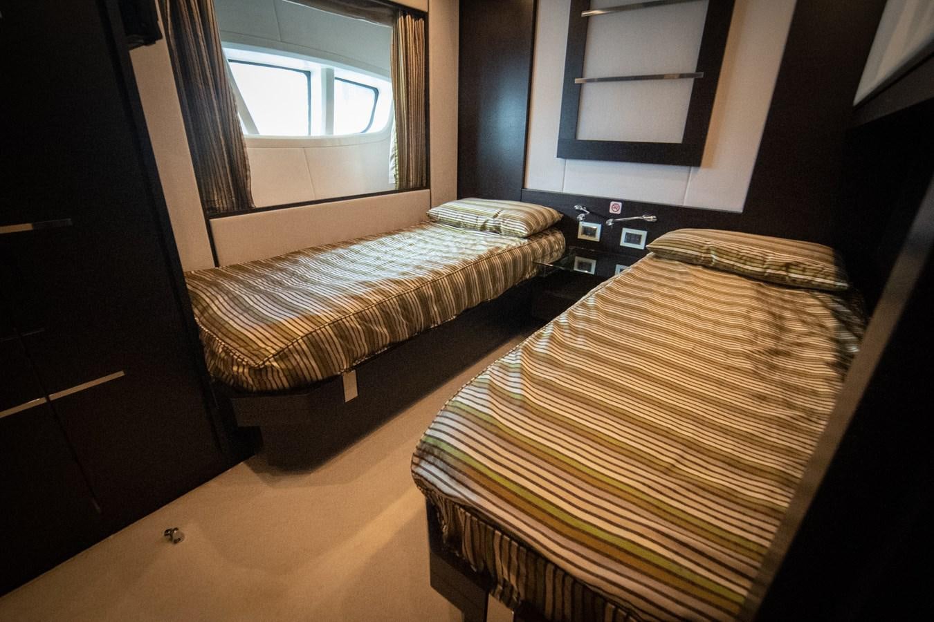 a couple of beds in a room aboard AQUARIUS Yacht for Sale
