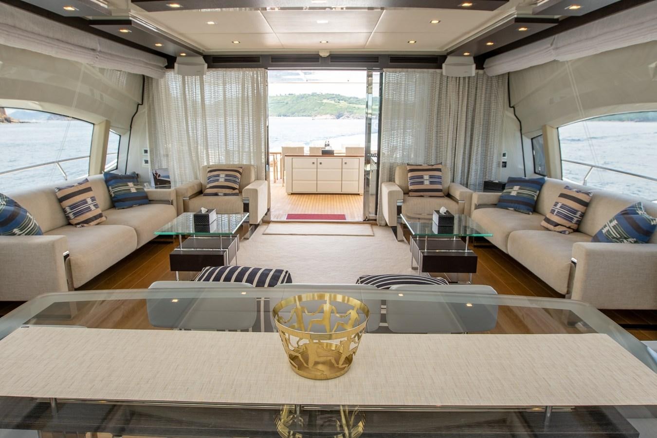 a living room with a large window aboard AQUARIUS Yacht for Sale