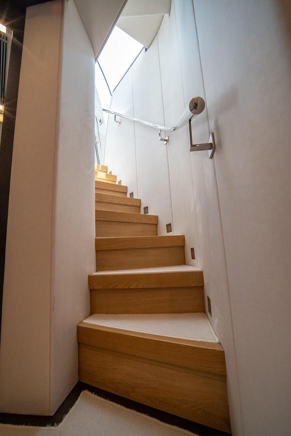 a staircase with a light aboard AQUARIUS Yacht for Sale