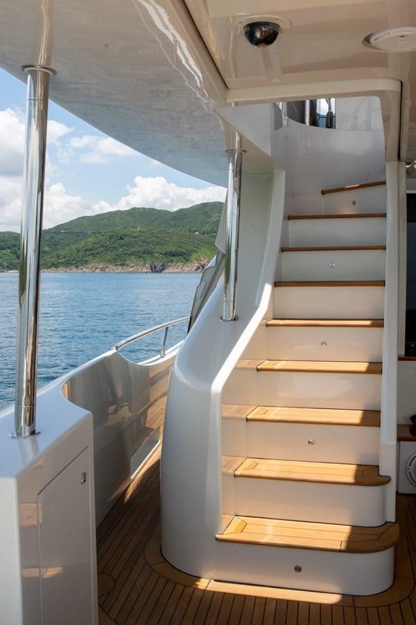 a boat with a wooden deck aboard AQUARIUS Yacht for Sale
