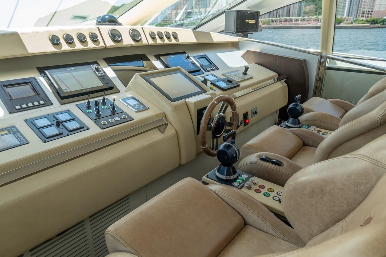a room with a couch and a laptop on it aboard AQUARIUS Yacht for Sale