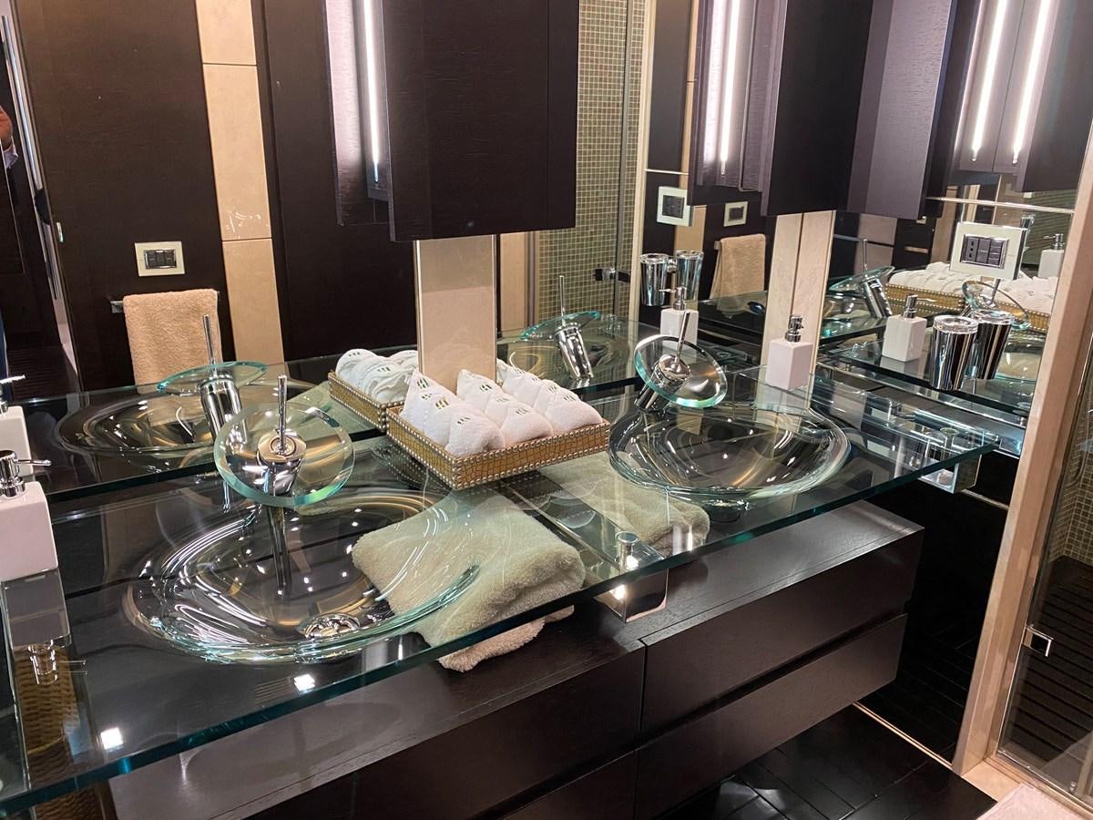 a counter with glasses on it aboard AQUARIUS Yacht for Sale