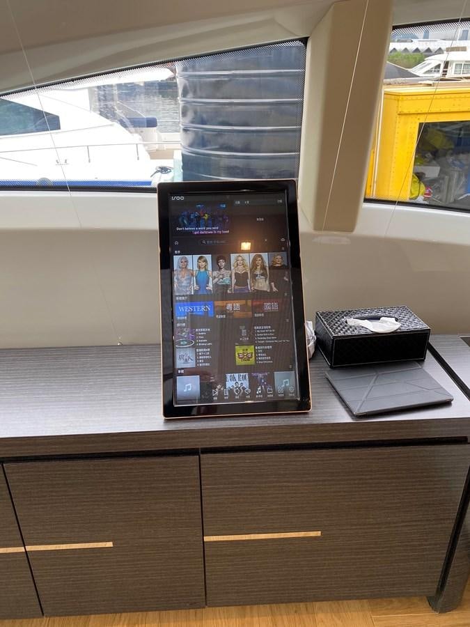 a computer on a desk aboard AQUARIUS Yacht for Sale