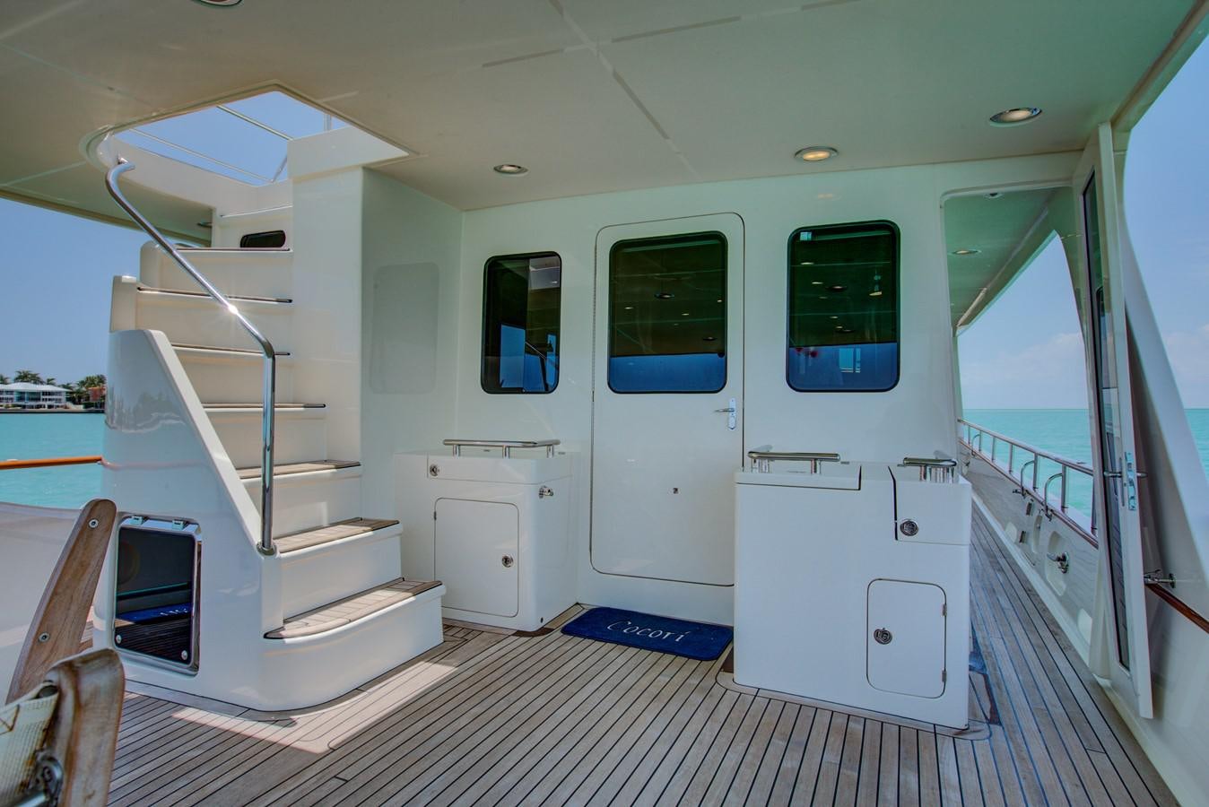 a white room with a slide aboard EXPLORER 97E-CB Yacht for Sale