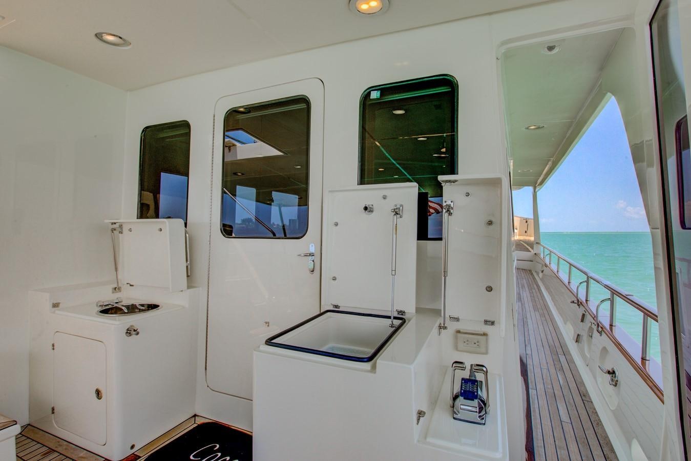 a white room with a pool aboard EXPLORER 97E-CB Yacht for Sale