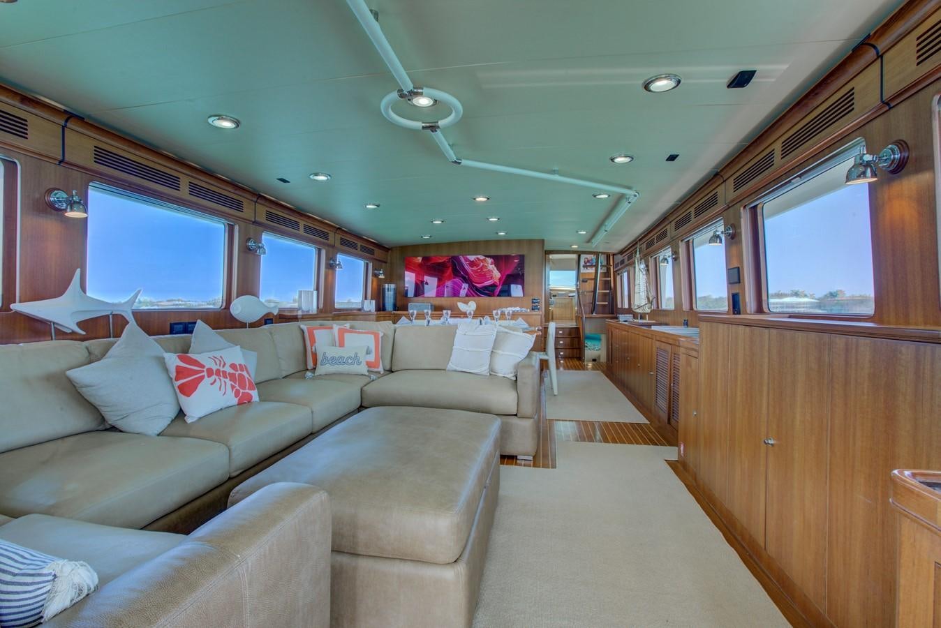 a train car with a couch and a television on the side aboard EXPLORER 97E-CB Yacht for Sale