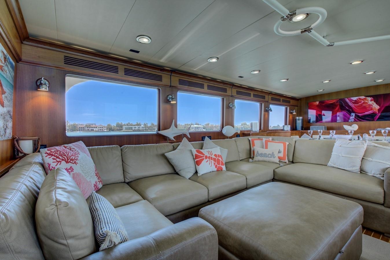 a living room with a large window aboard EXPLORER 97E-CB Yacht for Sale