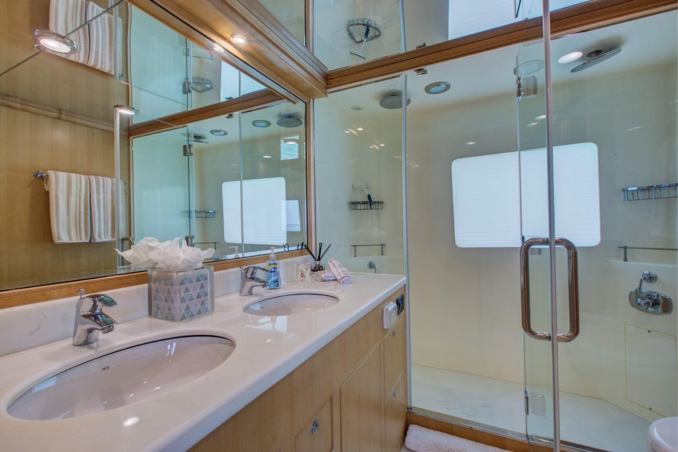 a bathroom with a standup shower aboard EXPLORER 97E-CB Yacht for Sale