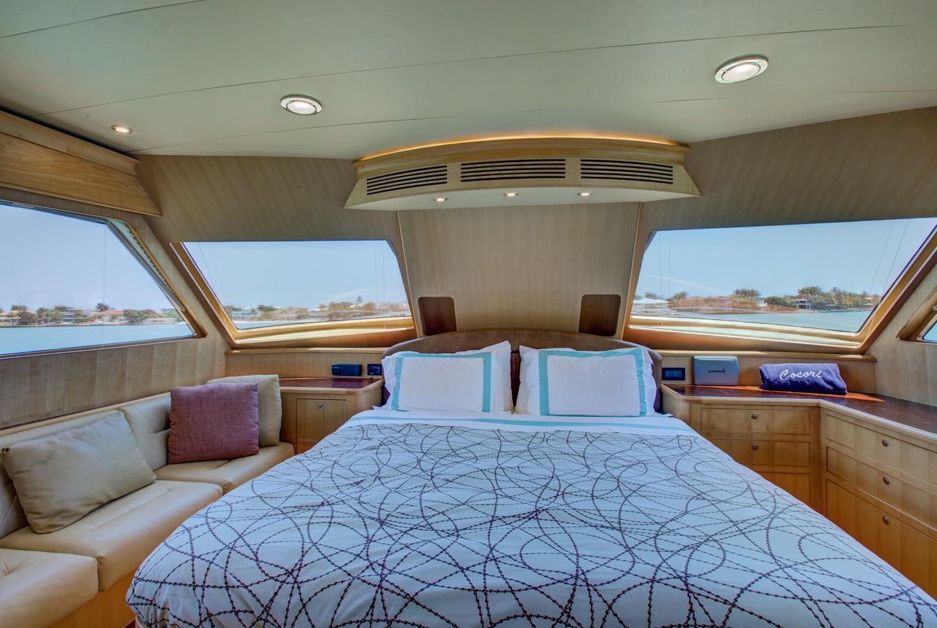 a large bed in a room aboard EXPLORER 97E-CB Yacht for Sale