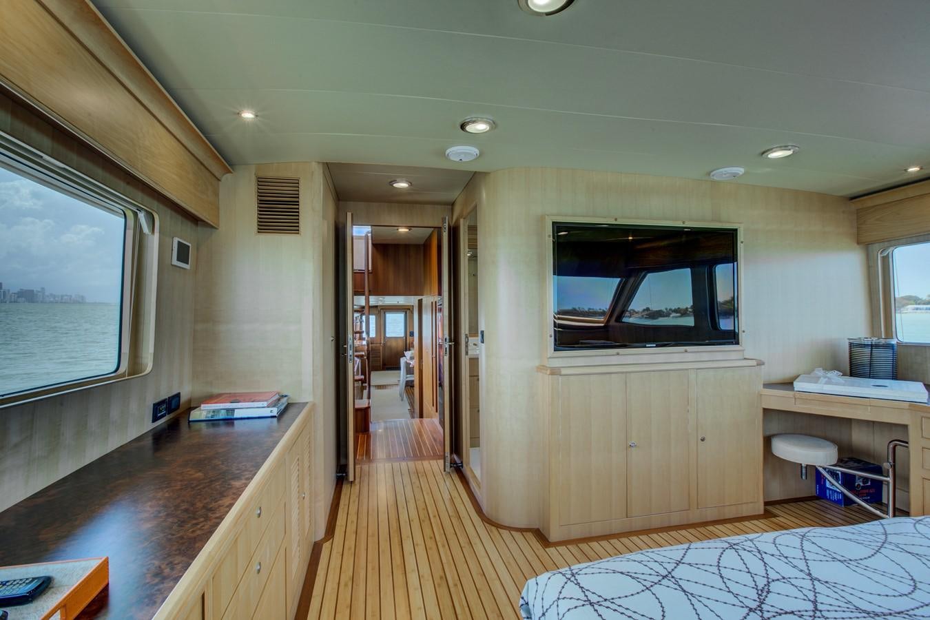 a room with a large tv aboard EXPLORER 97E-CB Yacht for Sale