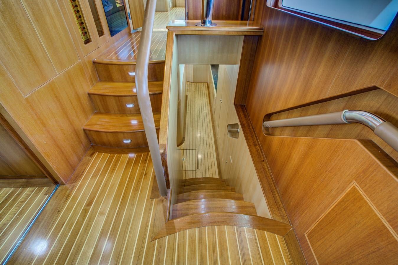a wooden staircase in a room aboard EXPLORER 97E-CB Yacht for Sale