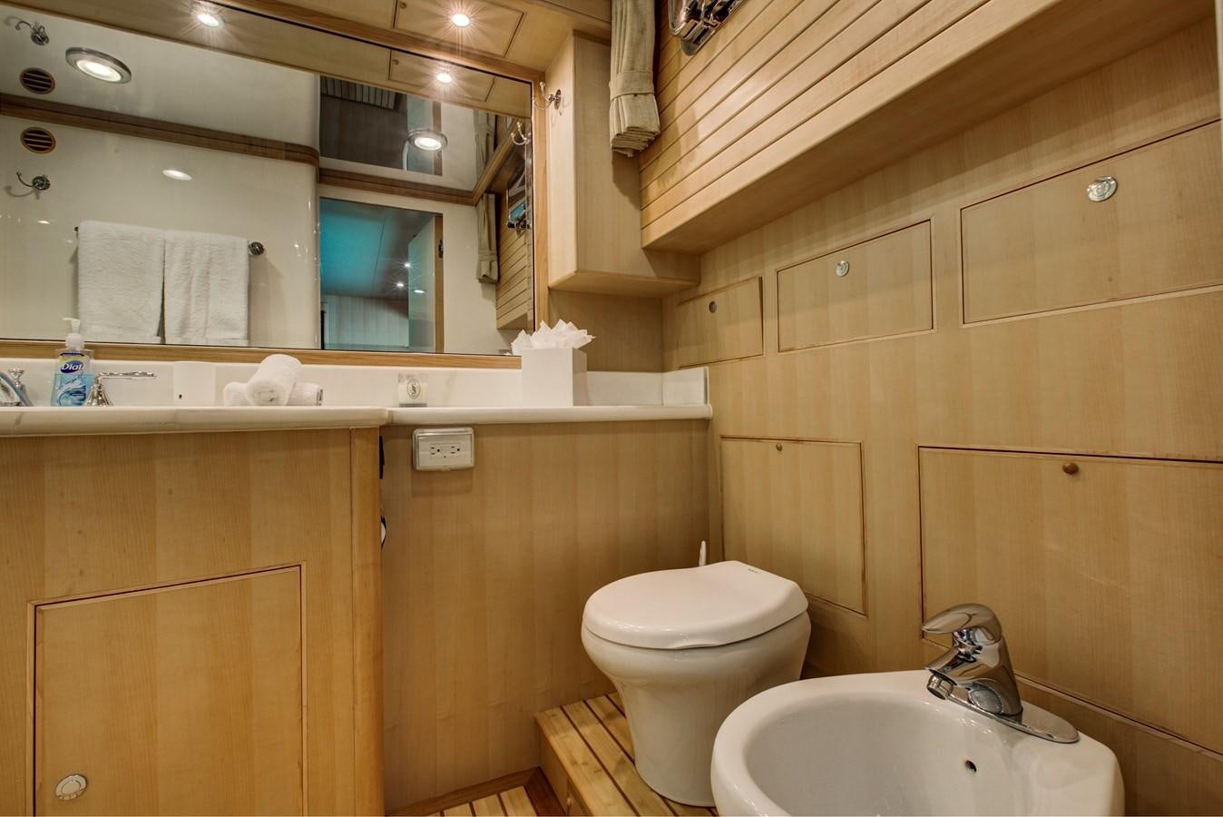 a bathroom with a sink and toilet aboard EXPLORER 97E-CB Yacht for Sale