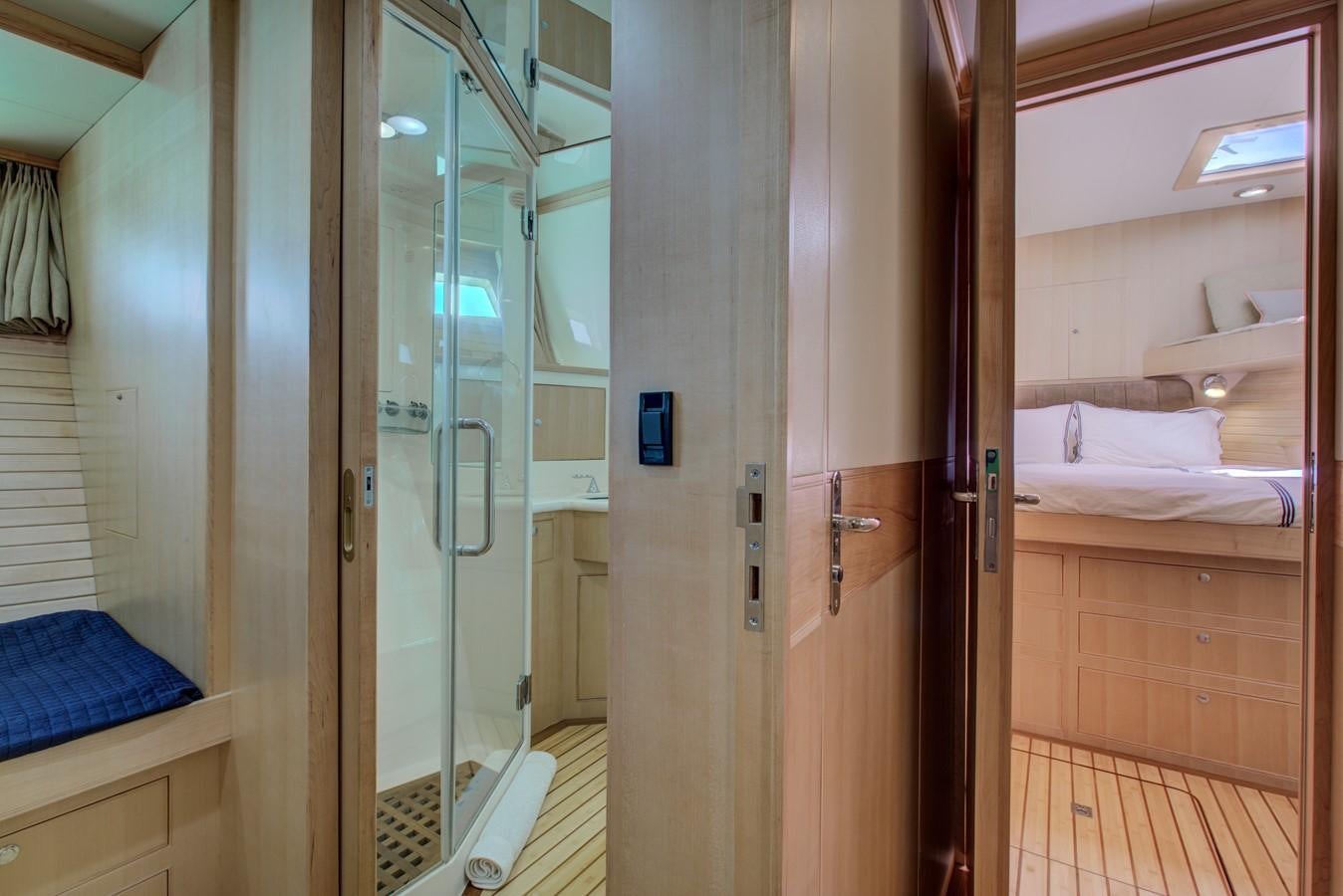 a bathroom with a glass shower aboard EXPLORER 97E-CB Yacht for Sale