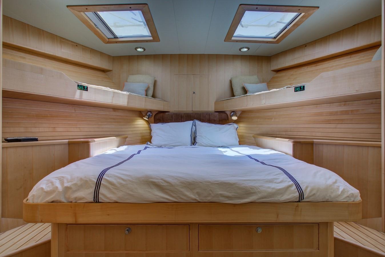 a room with bunk beds aboard EXPLORER 97E-CB Yacht for Sale