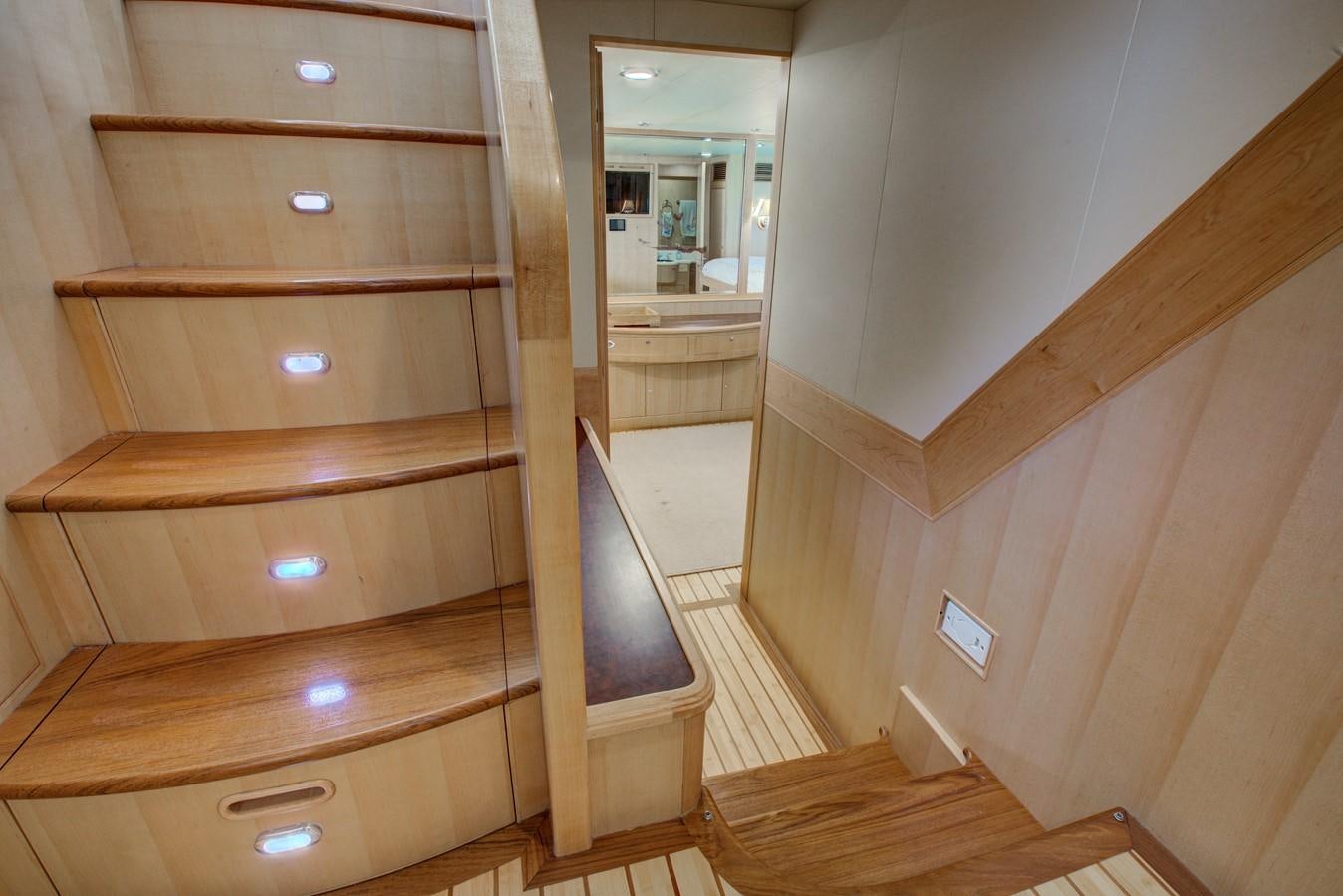 a wooden cabinet in a room aboard EXPLORER 97E-CB Yacht for Sale