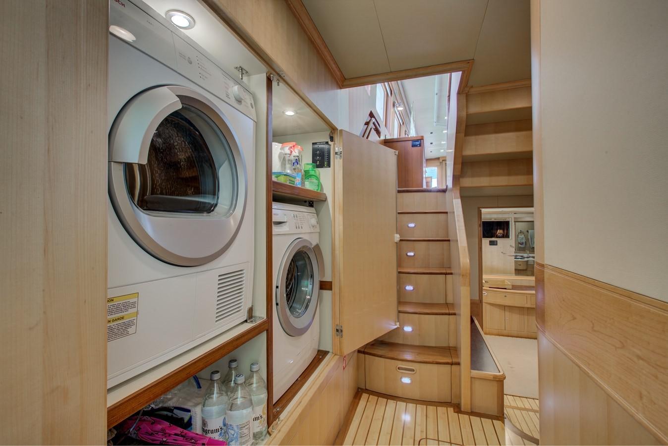 a room with a washer and dryer aboard EXPLORER 97E-CB Yacht for Sale