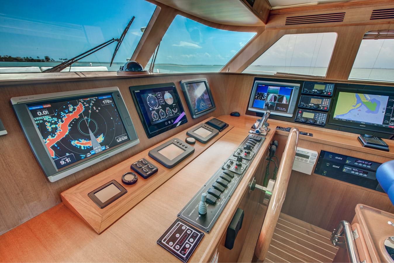 a control panel in a control room aboard EXPLORER 97E-CB Yacht for Sale