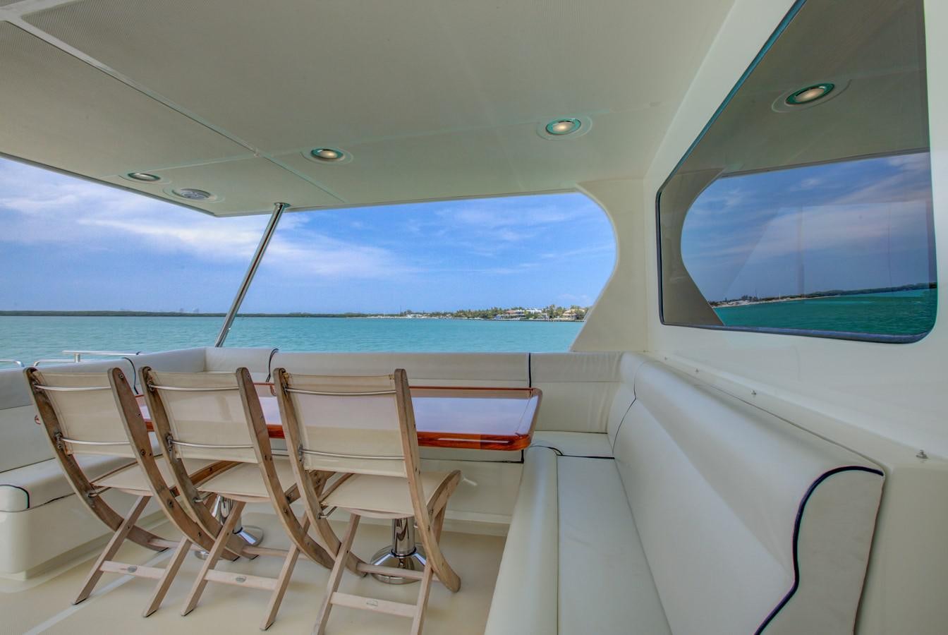 a boat with chairs on the deck aboard EXPLORER 97E-CB Yacht for Sale