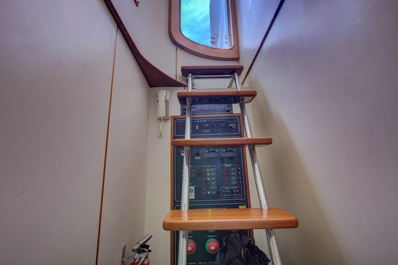 a computer tower on a wooden stand aboard EXPLORER 97E-CB Yacht for Sale