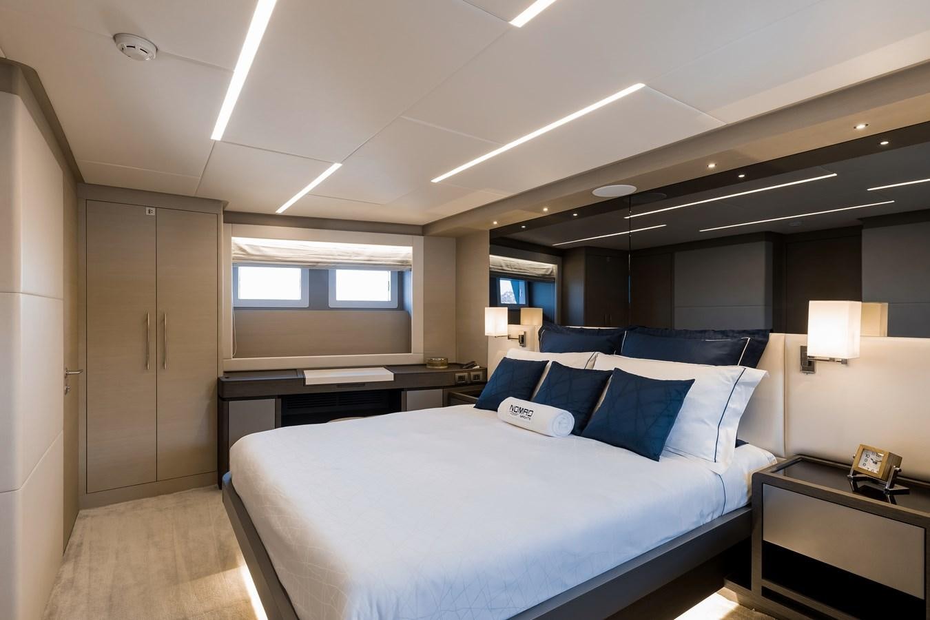 a large bed in a room aboard JEWEL Yacht for Sale