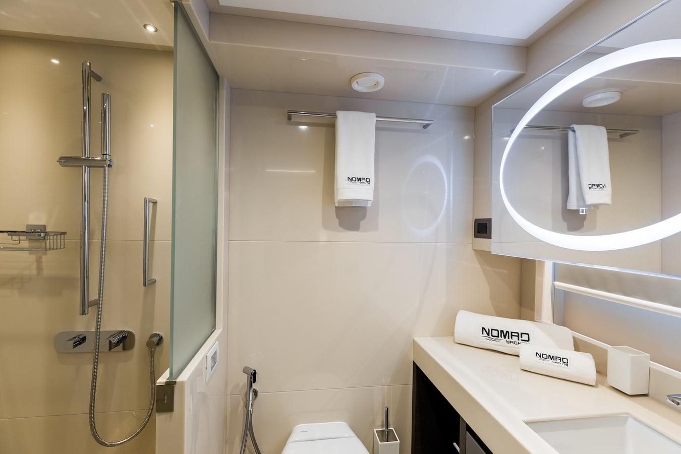 a bathroom with a mirror and a sink aboard JEWEL Yacht for Sale