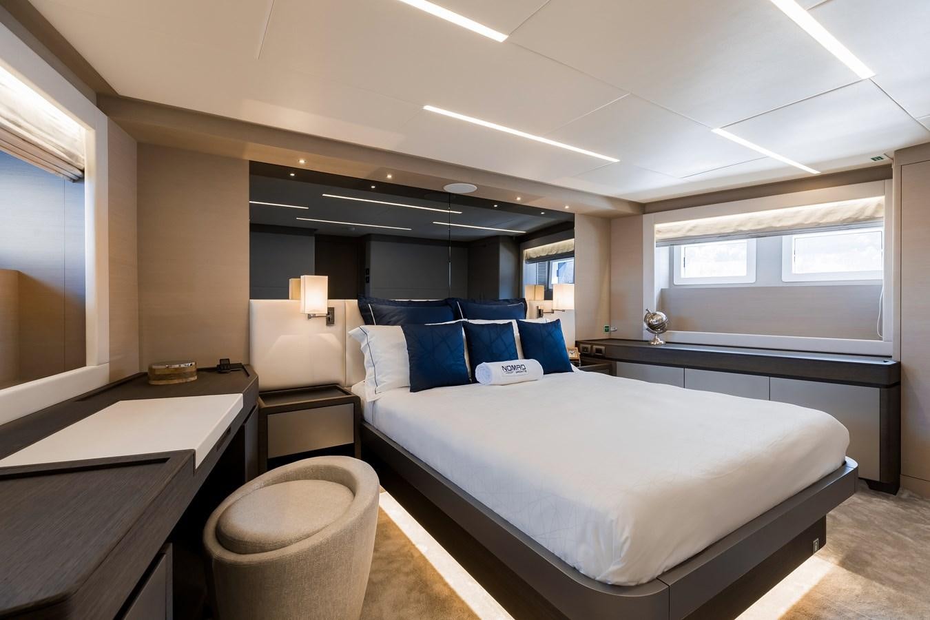 a room with a bed and a desk aboard JEWEL Yacht for Sale