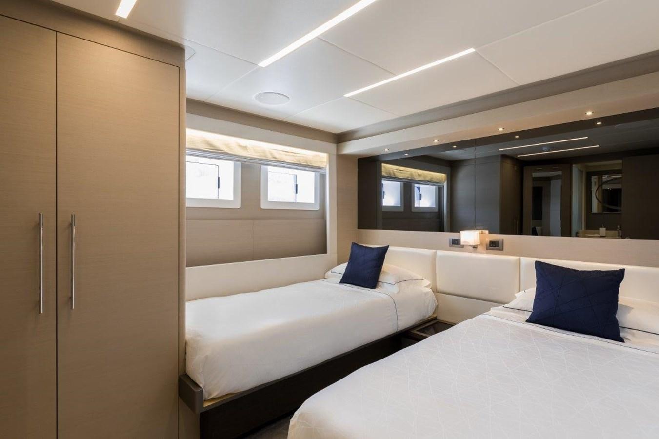a room with two beds aboard JEWEL Yacht for Sale