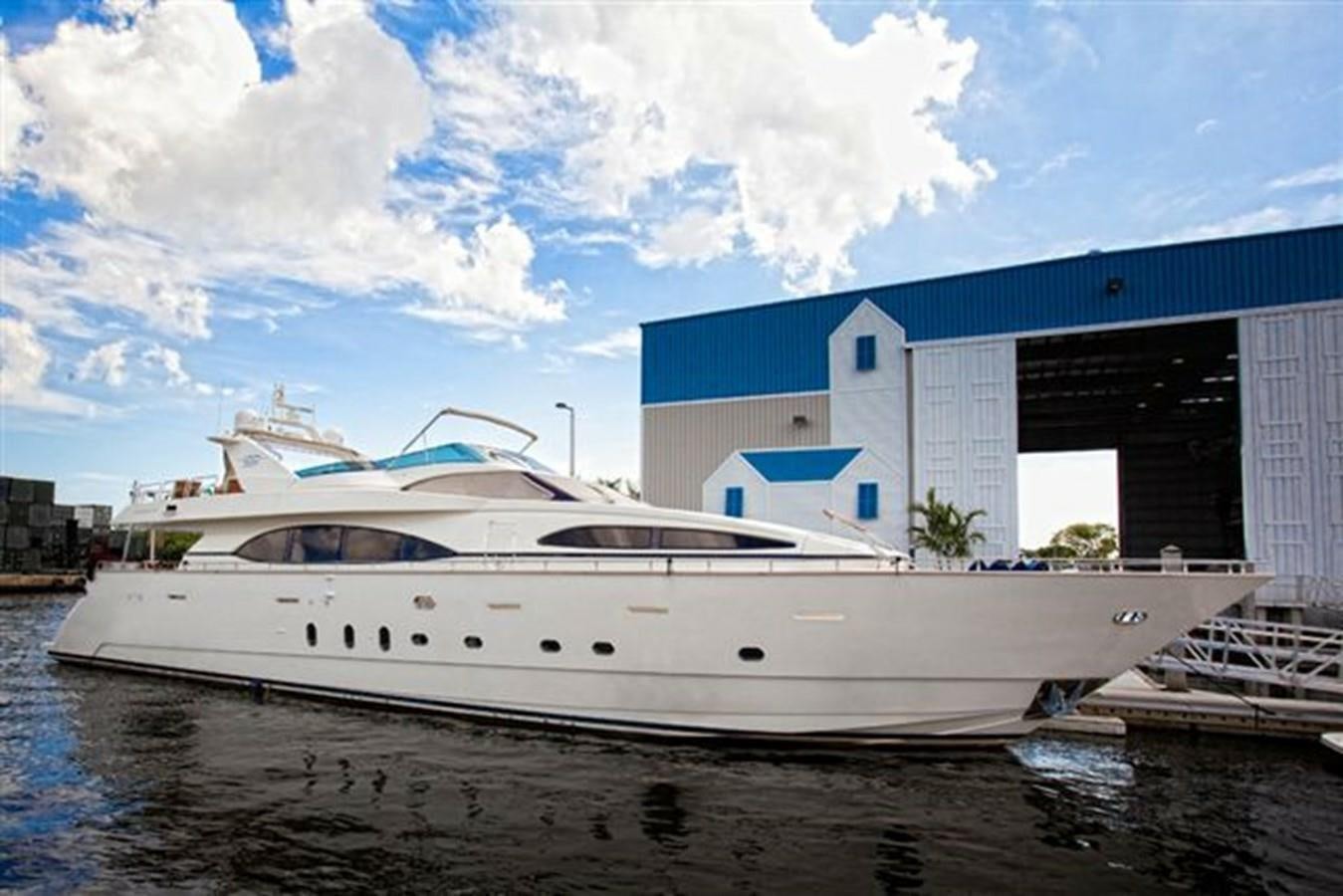 a white yacht in front of a building aboard DANIELA Yacht for Sale