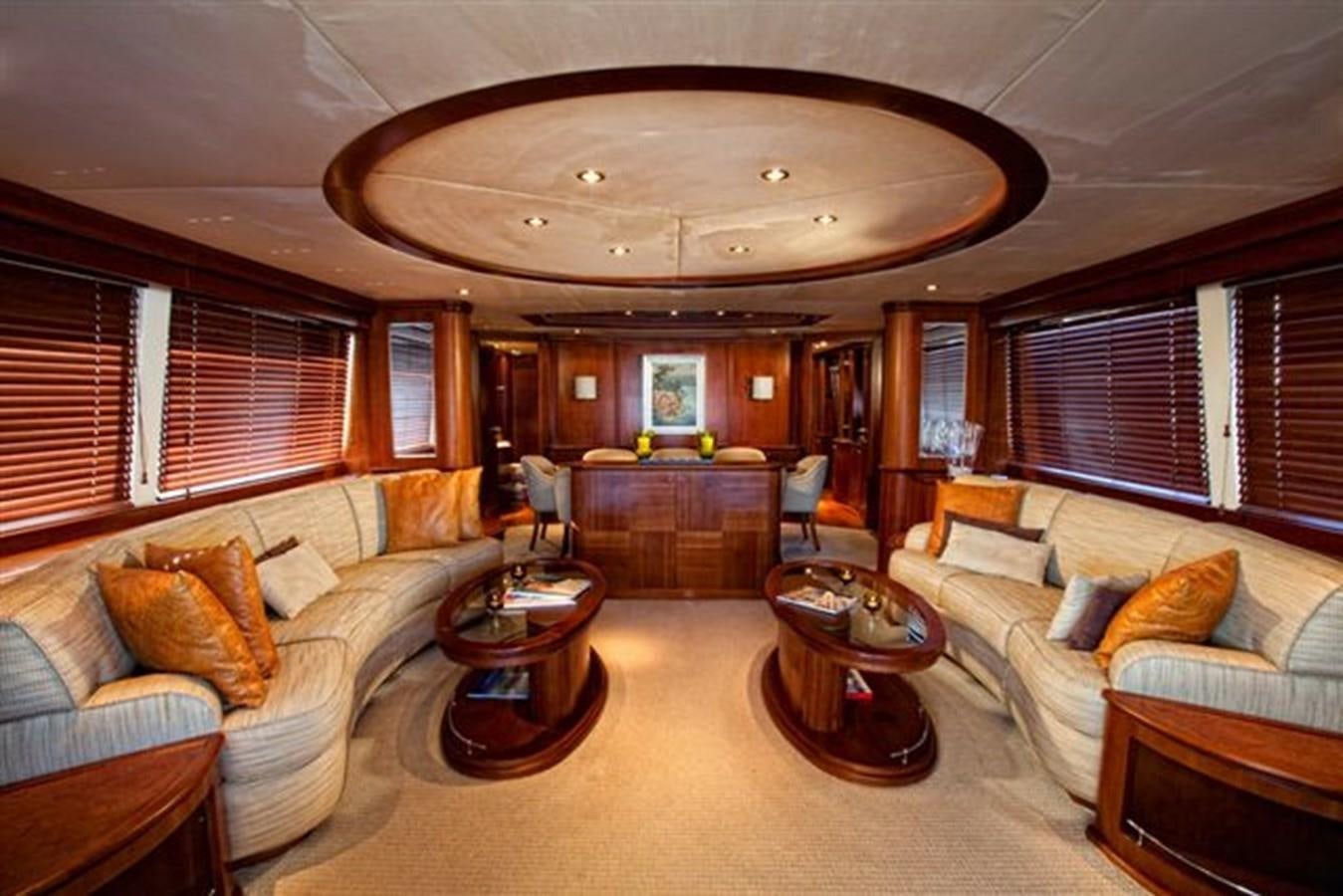a living room with a large chandelier aboard DANIELA Yacht for Sale