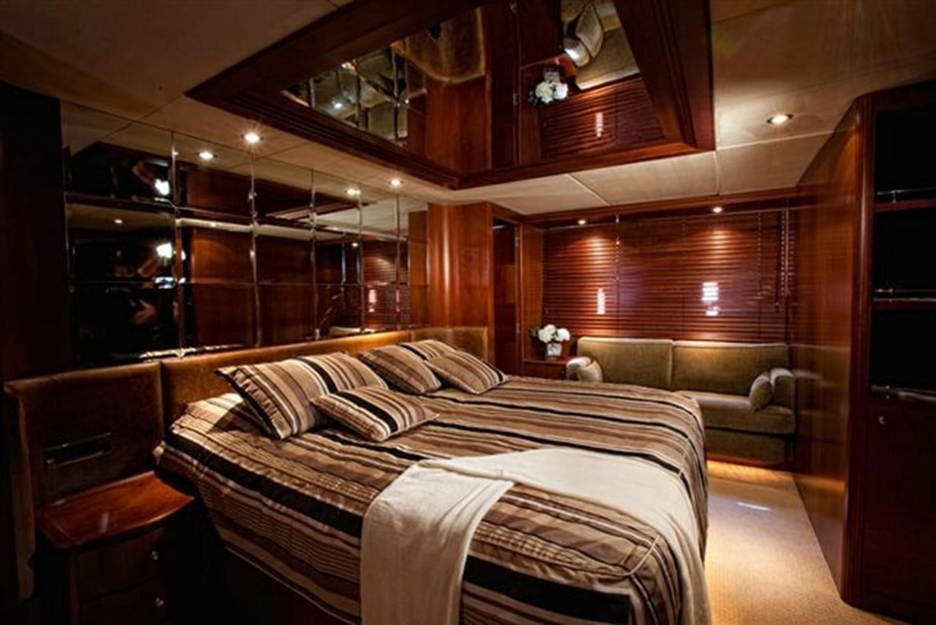 a room with a bed and a couch aboard DANIELA Yacht for Sale