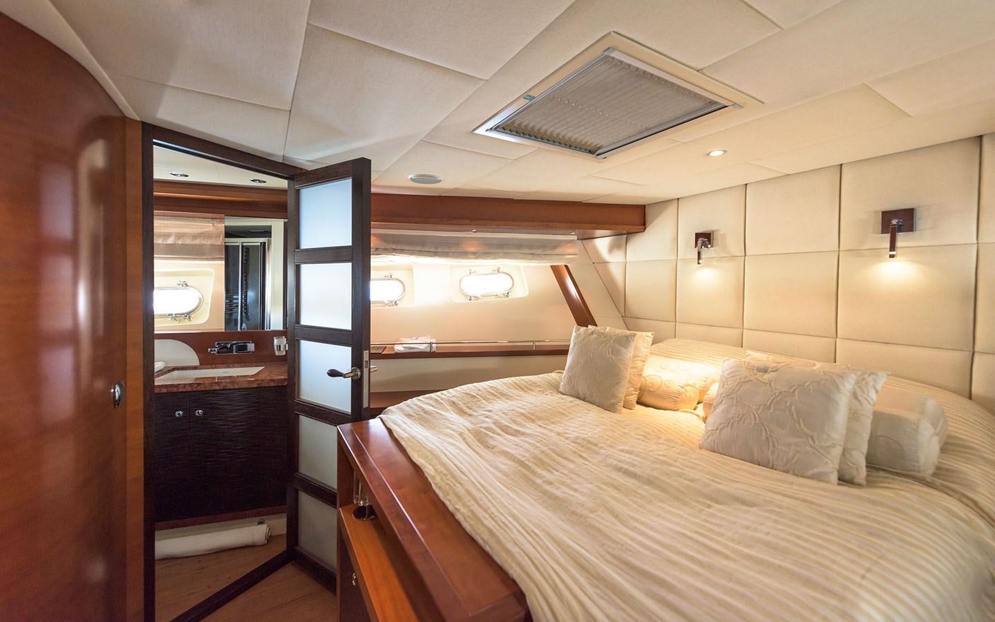 a bed in a room aboard LITTLE PERLE Yacht for Sale
