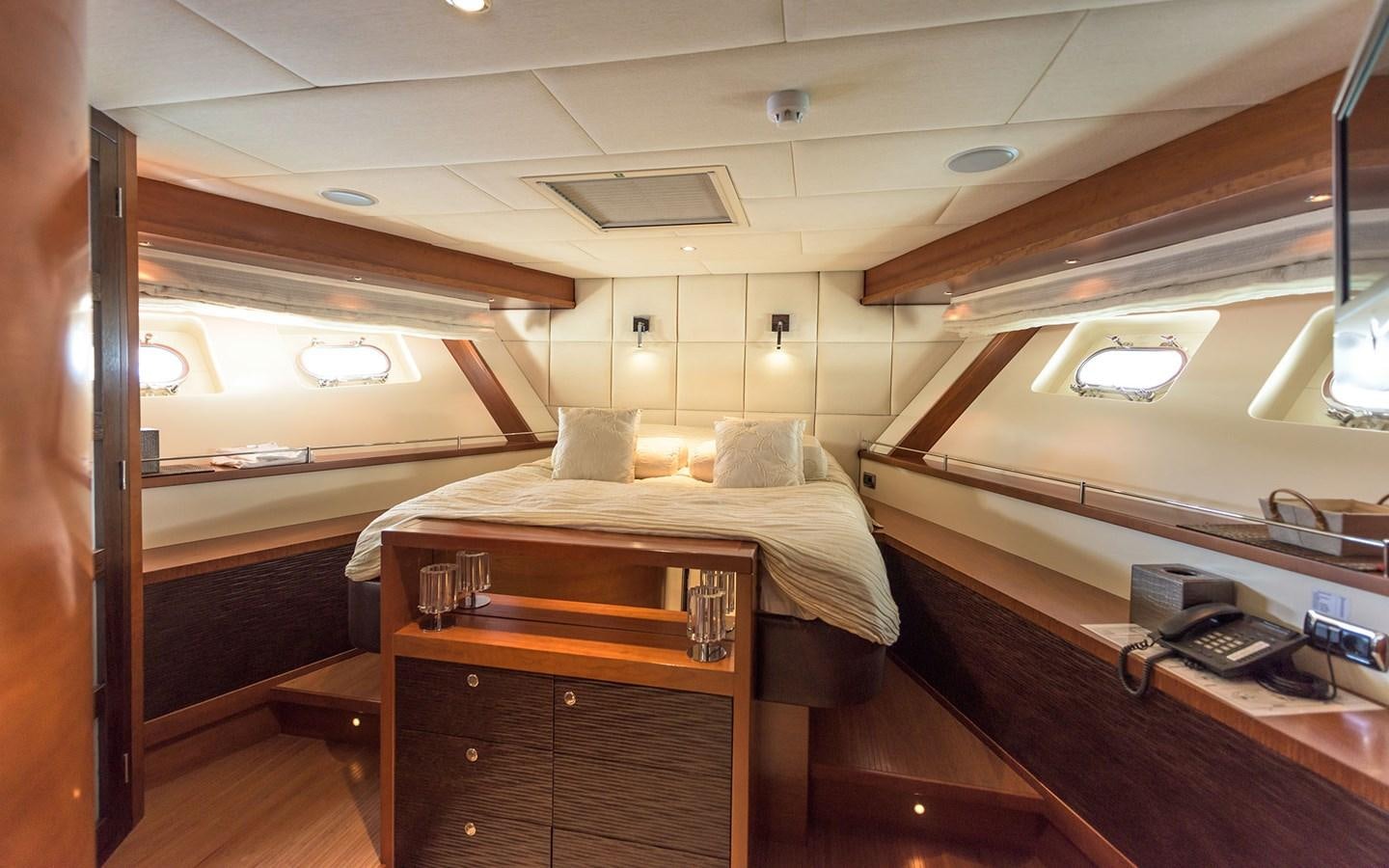 a room with beds and a phone aboard LITTLE PERLE Yacht for Sale