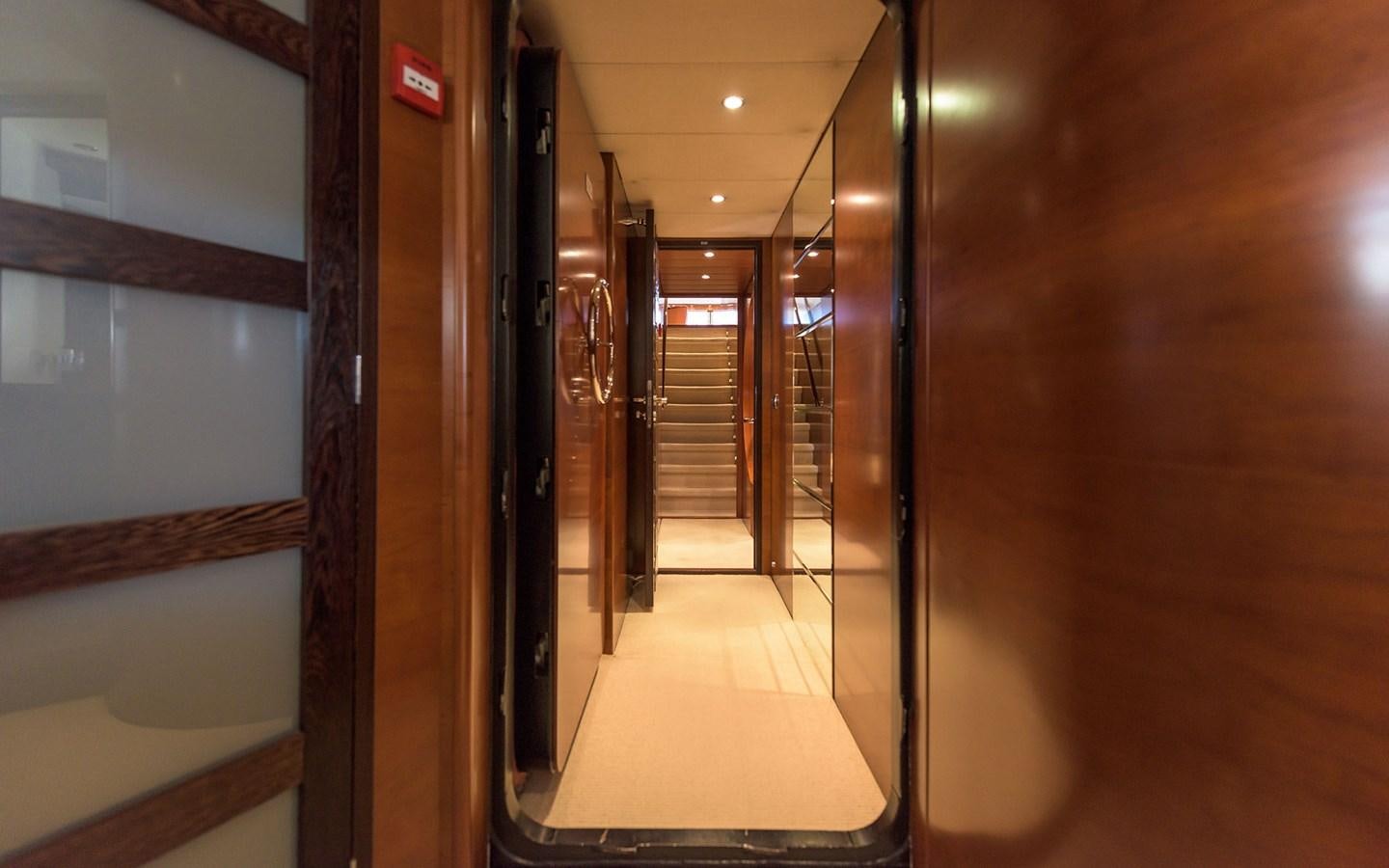 a hallway with glass doors aboard LITTLE PERLE Yacht for Sale