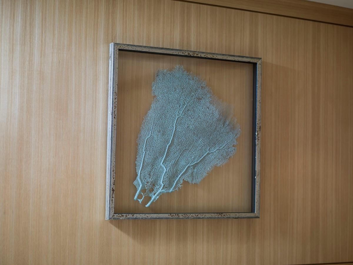 a painting on a wood surface aboard SATU Yacht for Sale