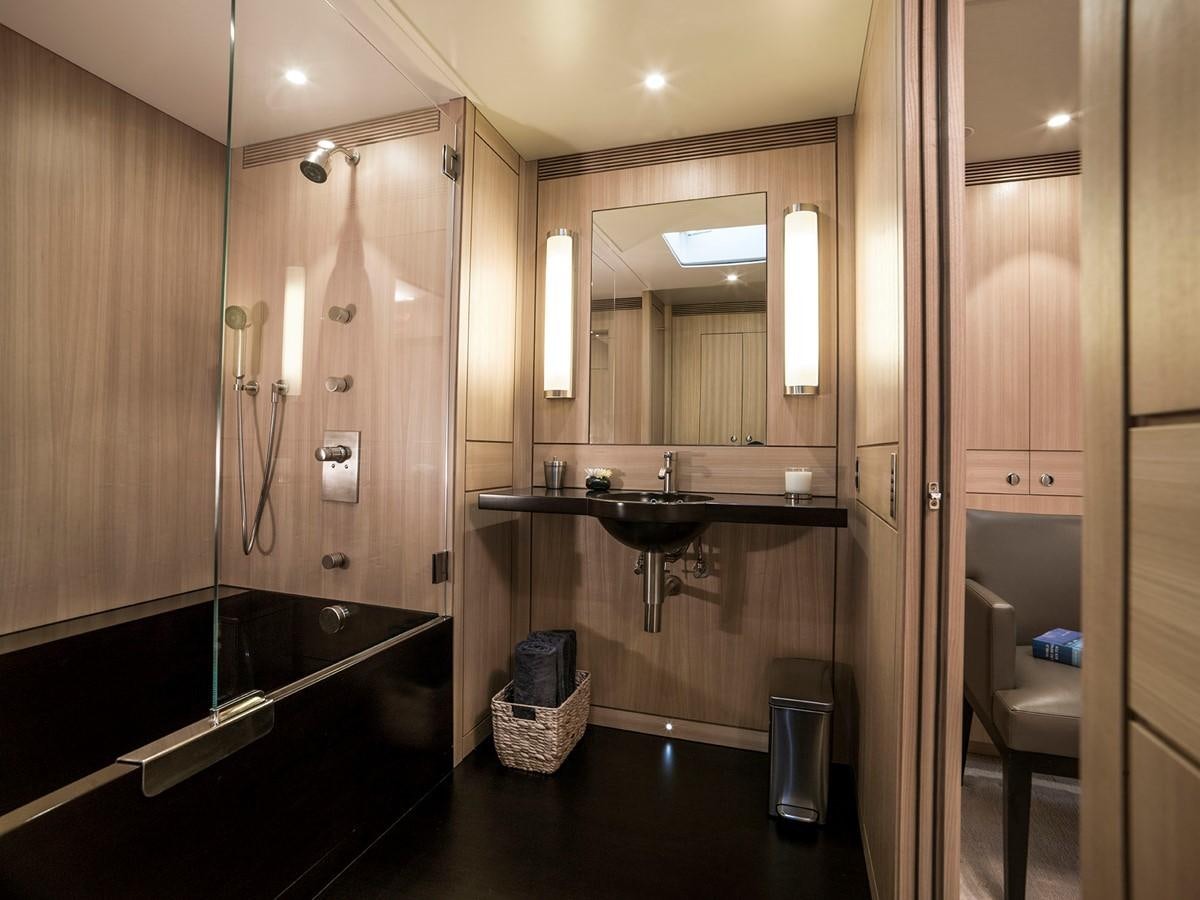 a bathroom with a tub sink and shower aboard SATU Yacht for Sale