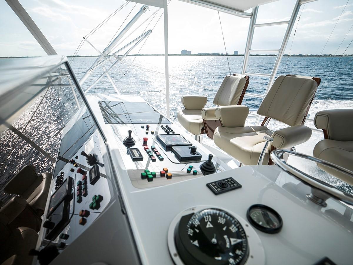 a boat with a group of seats aboard SATU Yacht for Sale