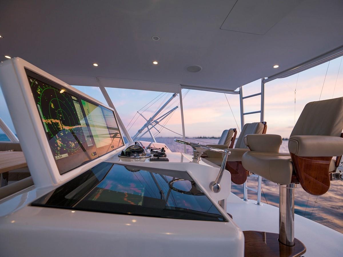 a car with a large screen aboard SATU Yacht for Sale